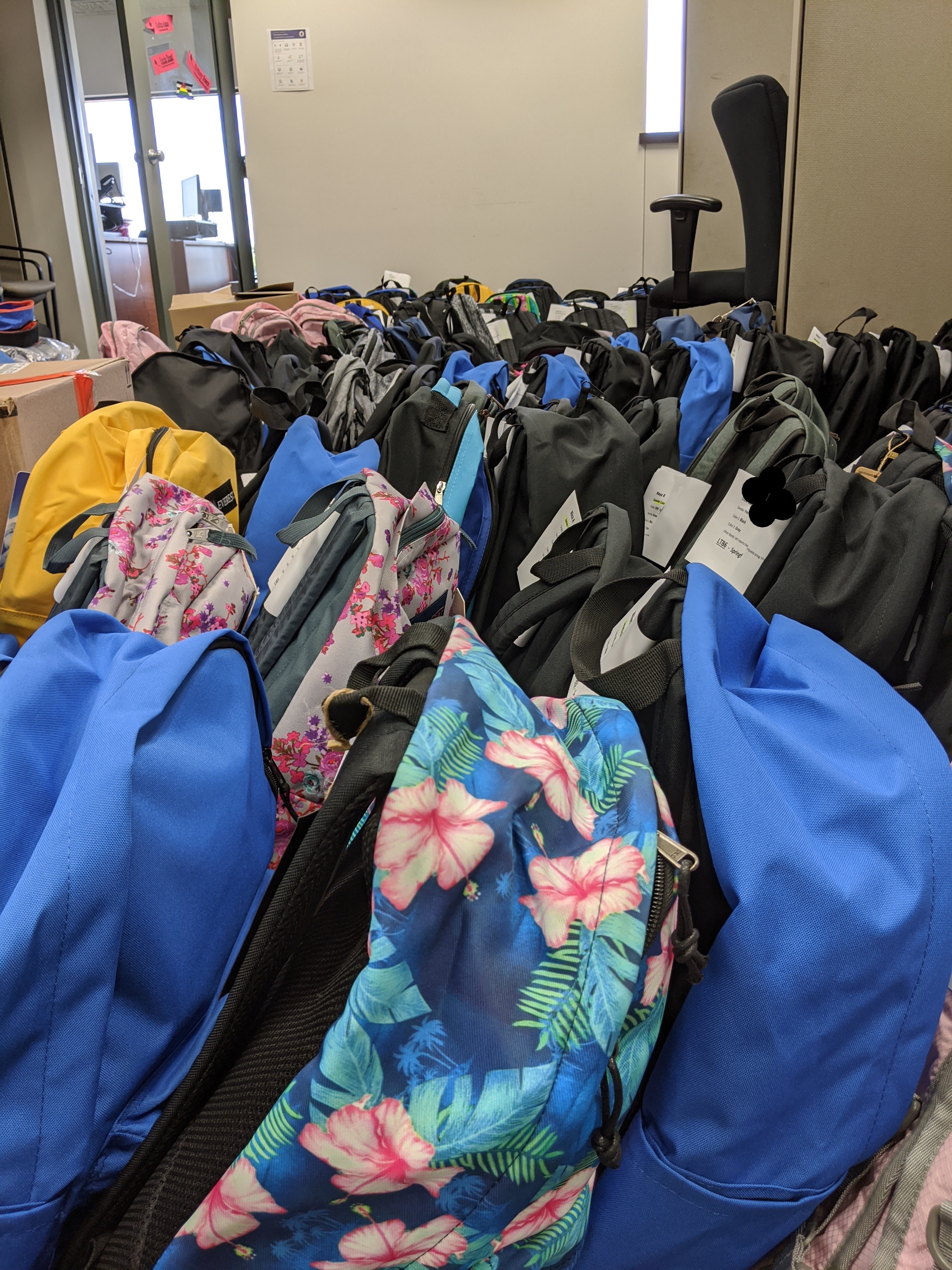 rows of backpacks